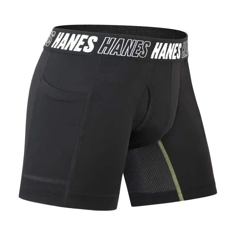 A black performance boxer brief rendered on a black background, with a branded elastic waistband and a mesh panel picked out along the leg.