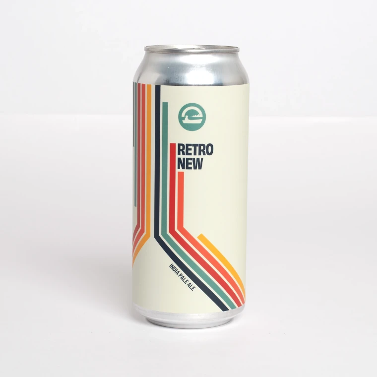 A tall Retro New India Pale Ale can photographed on white, its cream label carrying stacked teal, red and orange stripes that bend around the can beneath a circular canoe logo.