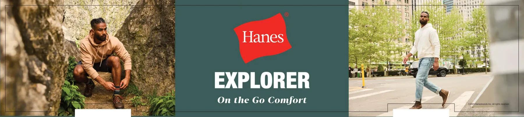 A long cap sign in three panels: a man crouching among rocks pulling on a sock, a teal centre panel carrying the red Hanes mark above the word Explorer and the line On the Go Comfort, and a man crossing a city street in jeans and a cream hoodie.